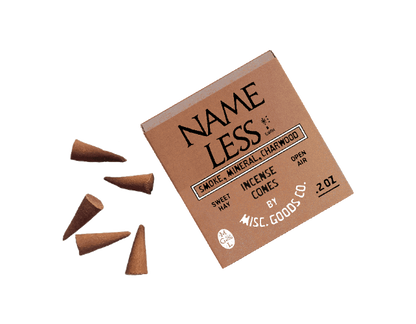 Box of Name Less Incense Cones with cones scattered around on a white background