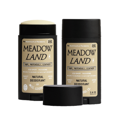 Two bottles of Meadow Land natural deodorant on a white background