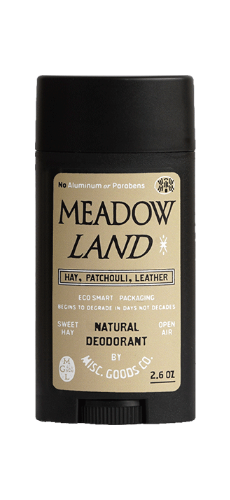 Meadow Land natural deodorant stick with black cap and beige label.
