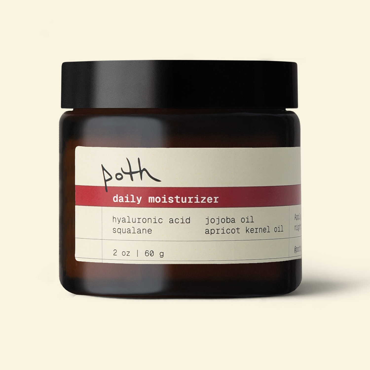 A jar of Poth Daily Moisturizer with a black lid, amber glass jar, and a cream-colored label with a red stripe, set against a solid light beige background.