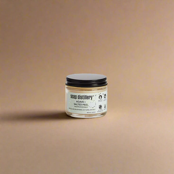 Jar of soap from Soap Distillery on a beige background