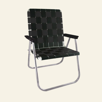A folding outdoor lounge chair with a black woven checkered webbing pattern on the seat and backrest, supported by a silver metal tubular frame.