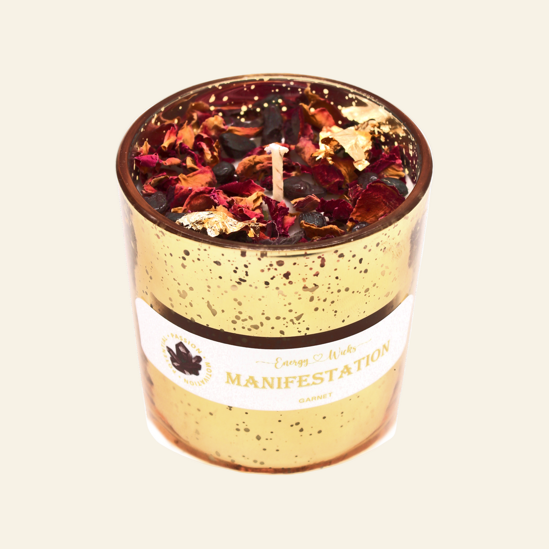 Candle in a gold-speckled container with dried flowers, labeled &