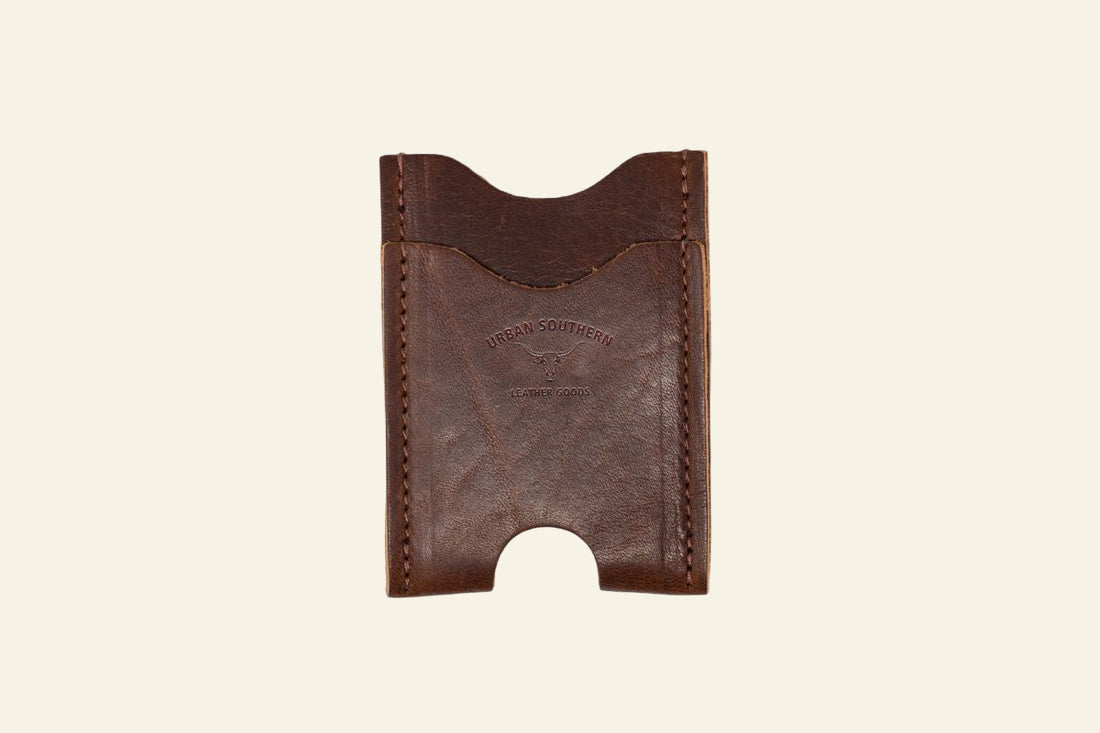 Brown leather cardholder on a white background
