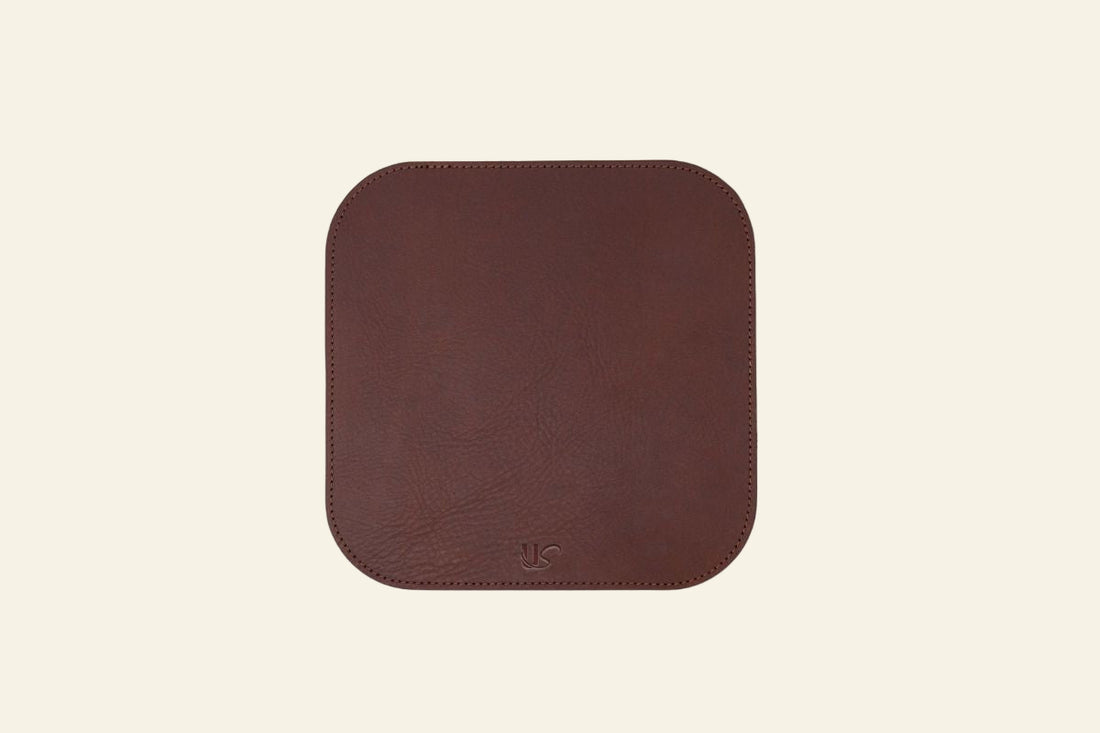 Brown square mouse pad on a white background