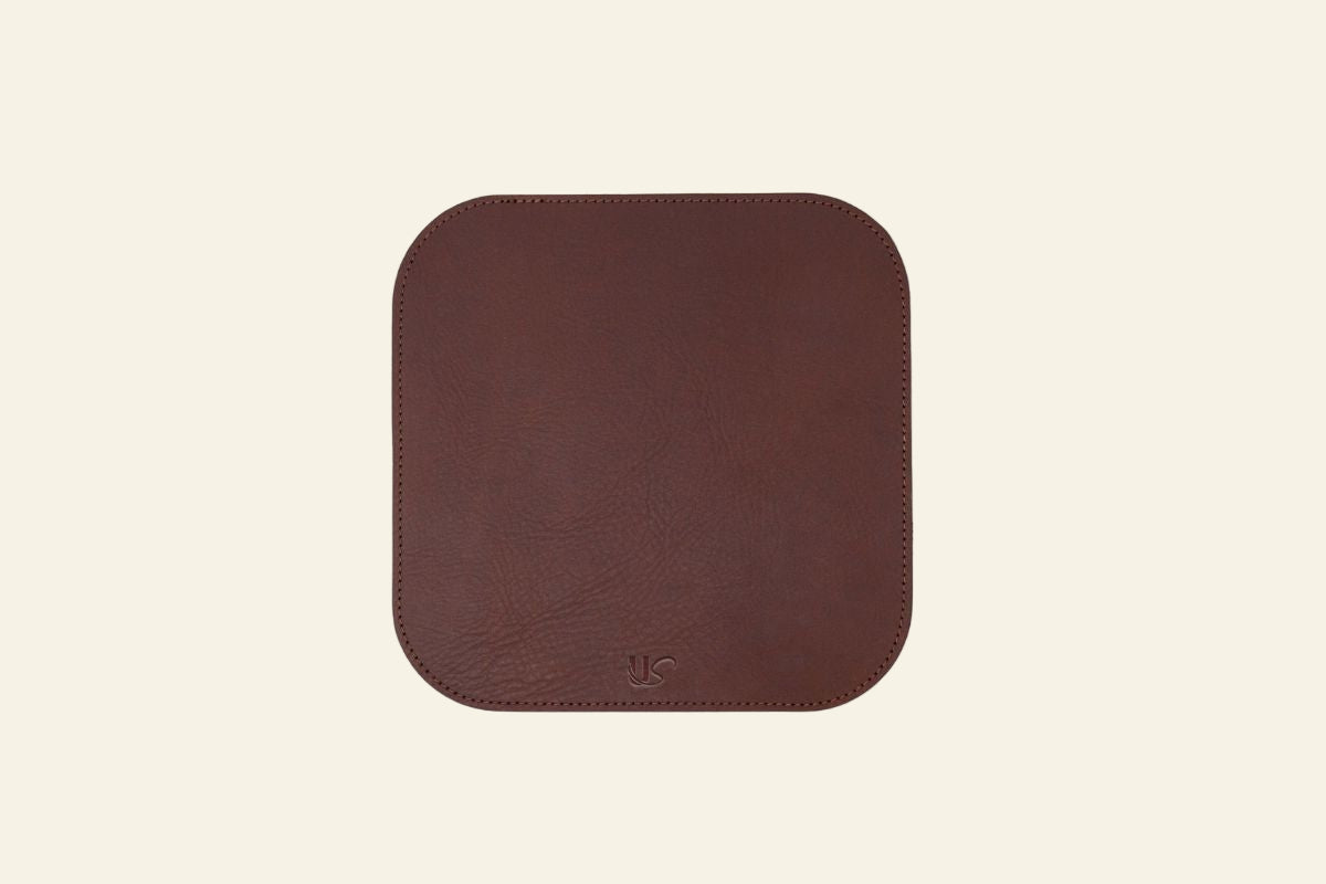 Brown square mouse pad on a white background