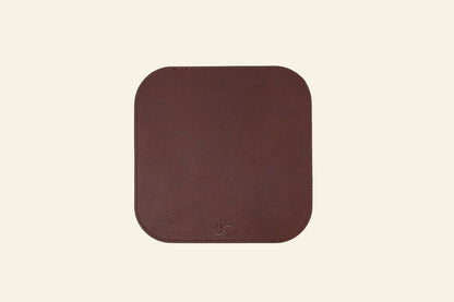 Brown square mouse pad on a white background