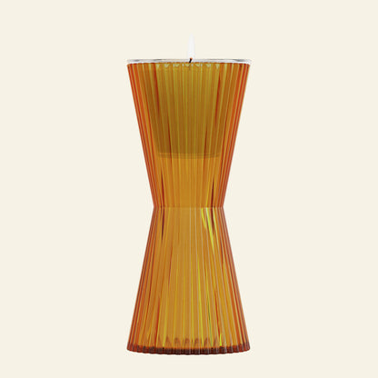 Transparent orange candle holder on a white background