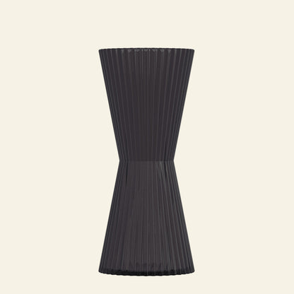 Black ribbed vase on a white background