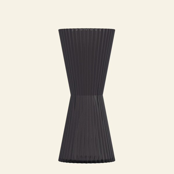Black ribbed vase on a white background