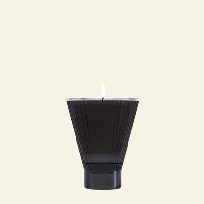 Black textured candle on a white background