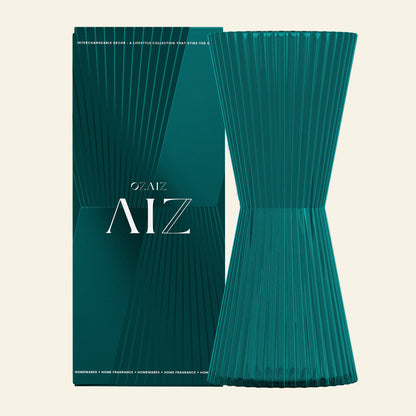 Teal ribbed vase with packaging displaying &