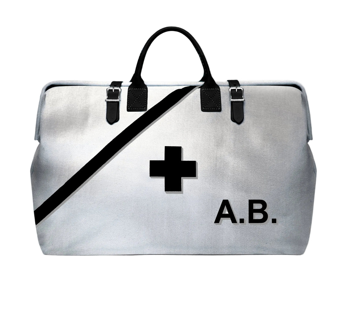 Silver bag with black cross and &