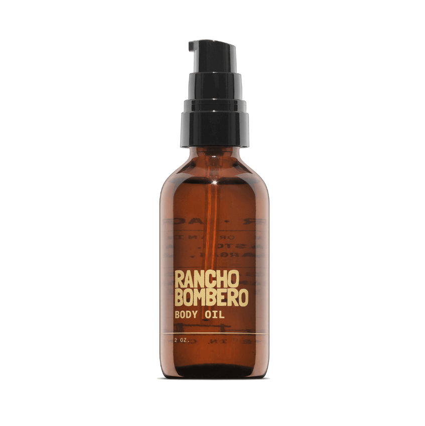 Rancho Bombero body oil bottle on a black background