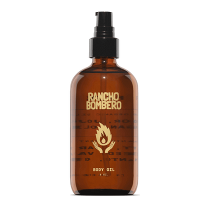 Rancho Bombero body oil bottle with a black spray cap on a white background