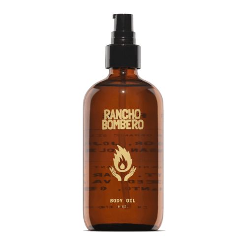 Rancho Bombero body oil bottle with a black spray cap on a white background