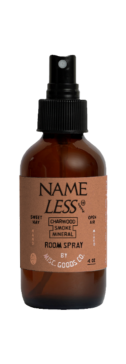 Brown room spray bottle with black sprayer labeled &