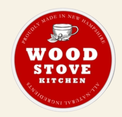Round logo for Wood Stove Kitchen with a red background and white text.