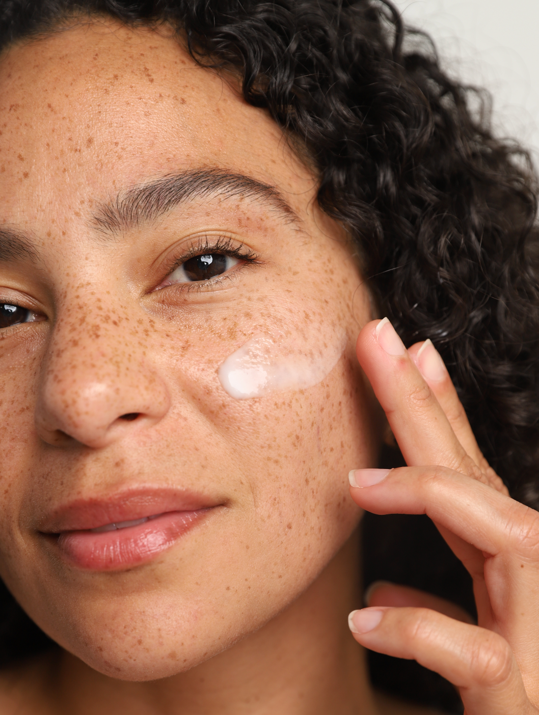 corrective green tea cleanser on face