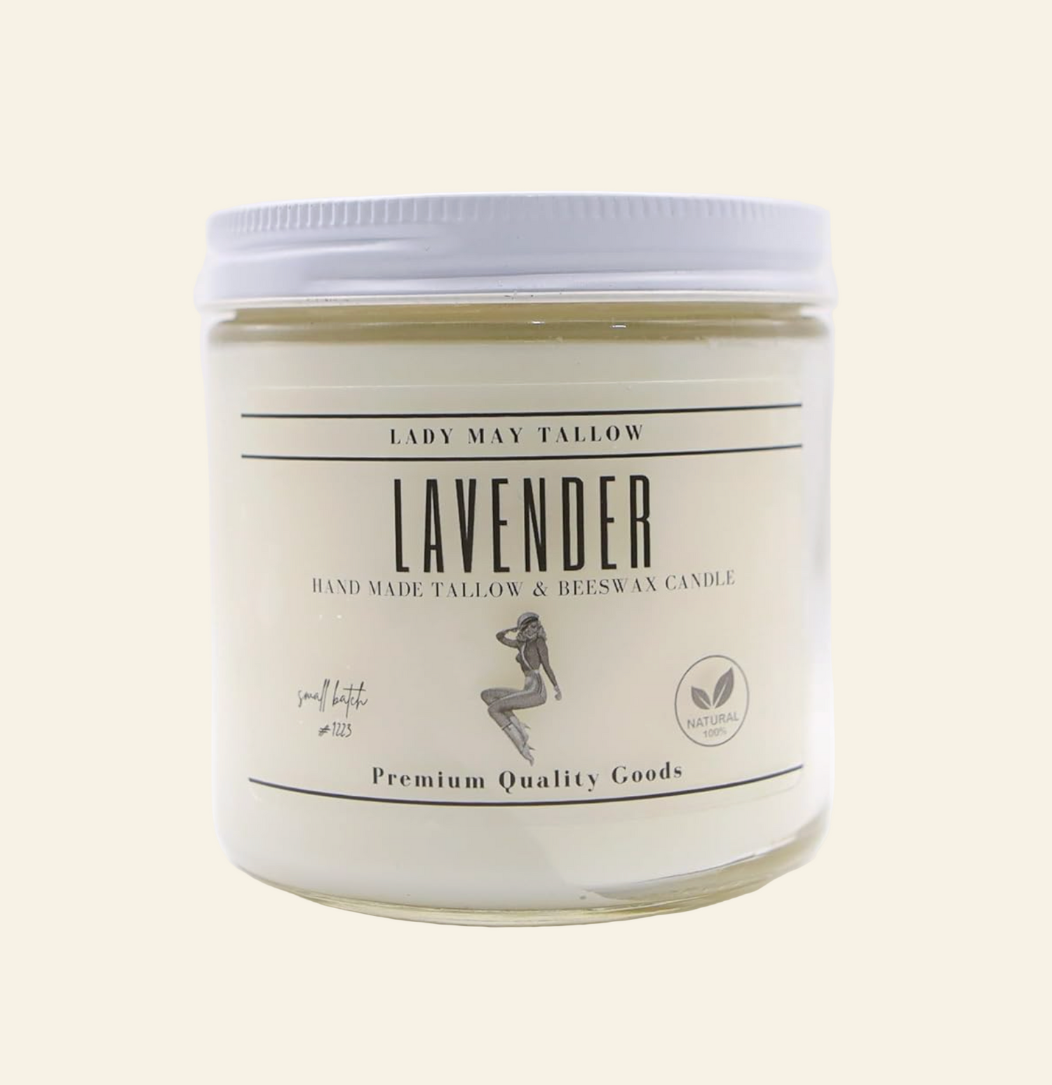 Lavender candle in a glass jar with a white label on a white background