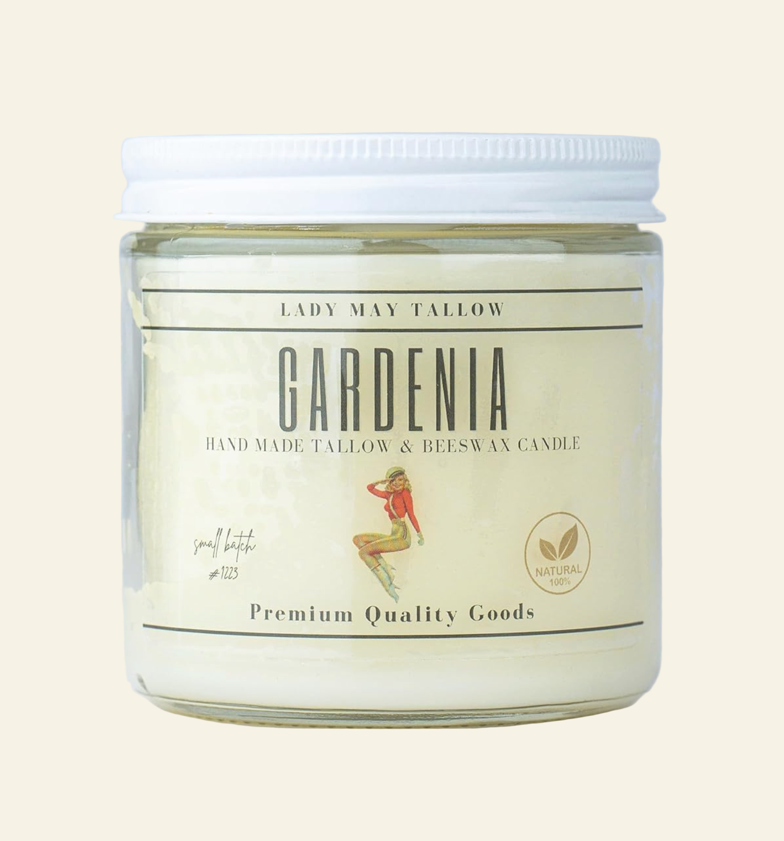 Glass candle jar with white lid labeled &