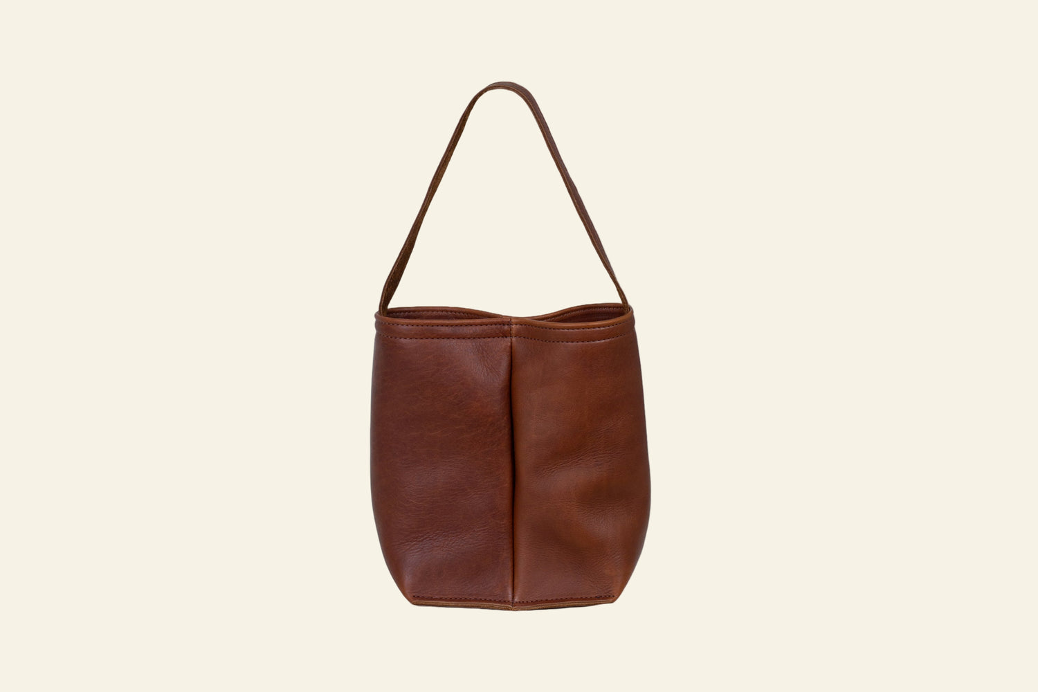 Brown leather handbag on a white background
