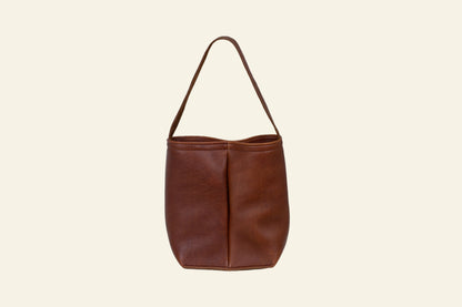 Brown leather handbag on a white background