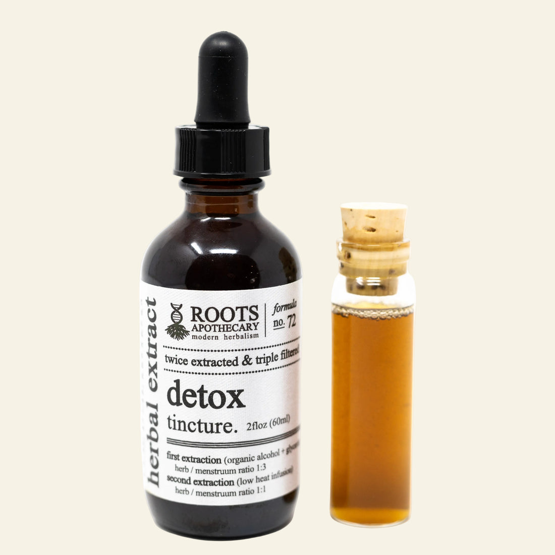 Roots Apothecary detox tincture bottle with dropper and smaller sample bottle on a white background