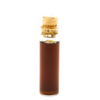 Glass bottle with cork stopper on a white background