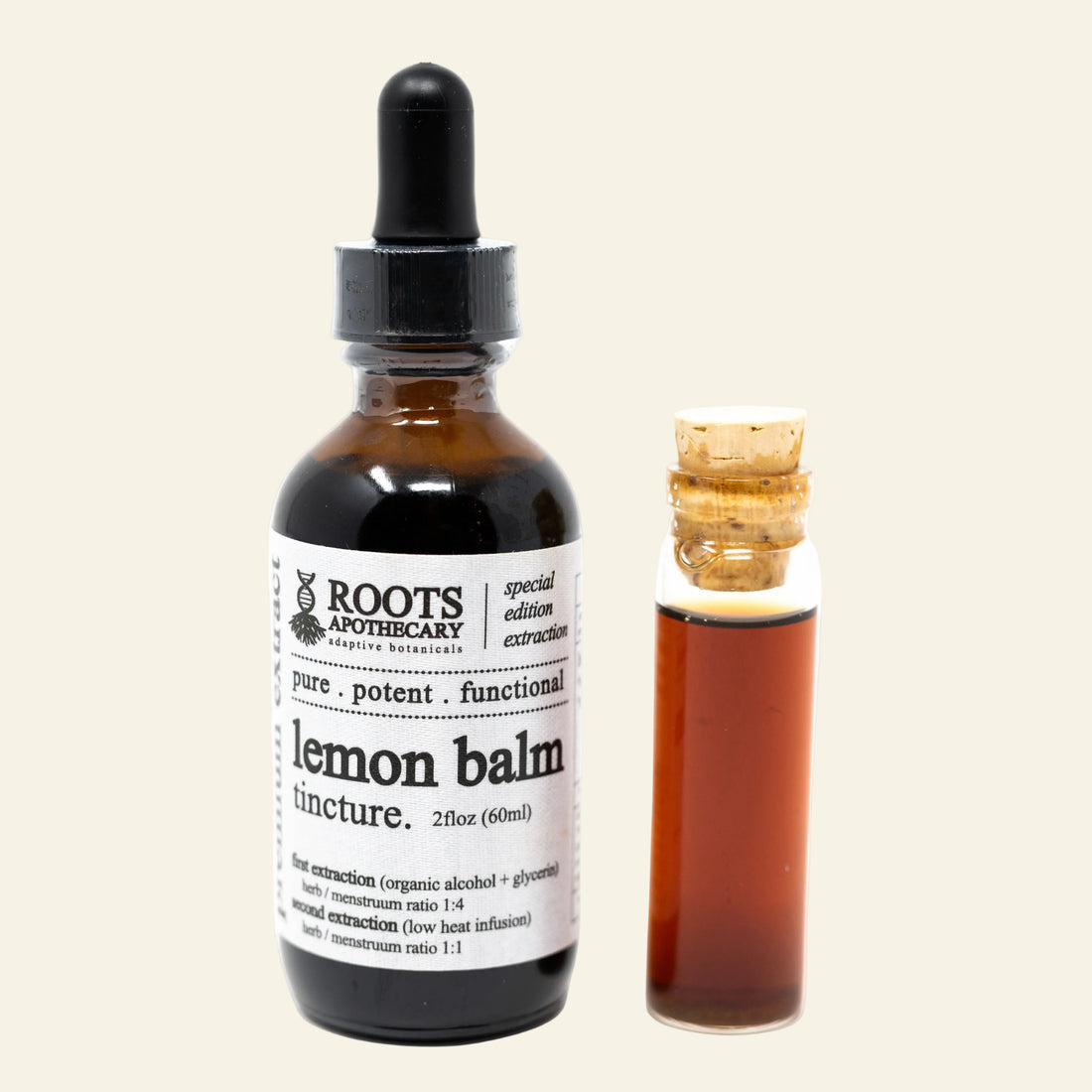 An amber glass dropper bottle labeled Roots Apothecary Lemon Balm tincture next to a small cork vial containing the amber liquid, on a white background.