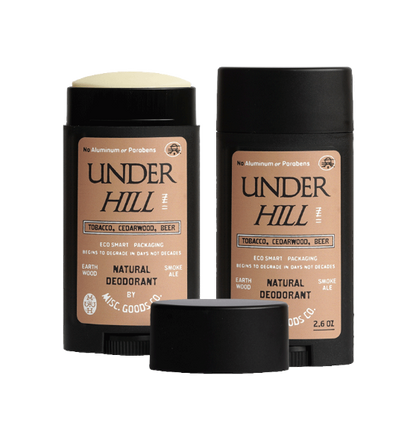 Two Under Hill natural deodorants with black caps on a white background