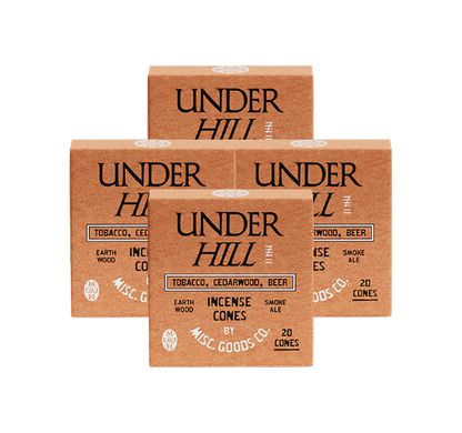 Four boxes of Under Hill Incense Cones on a white background