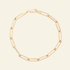 Gold chain bracelet on a light gray background