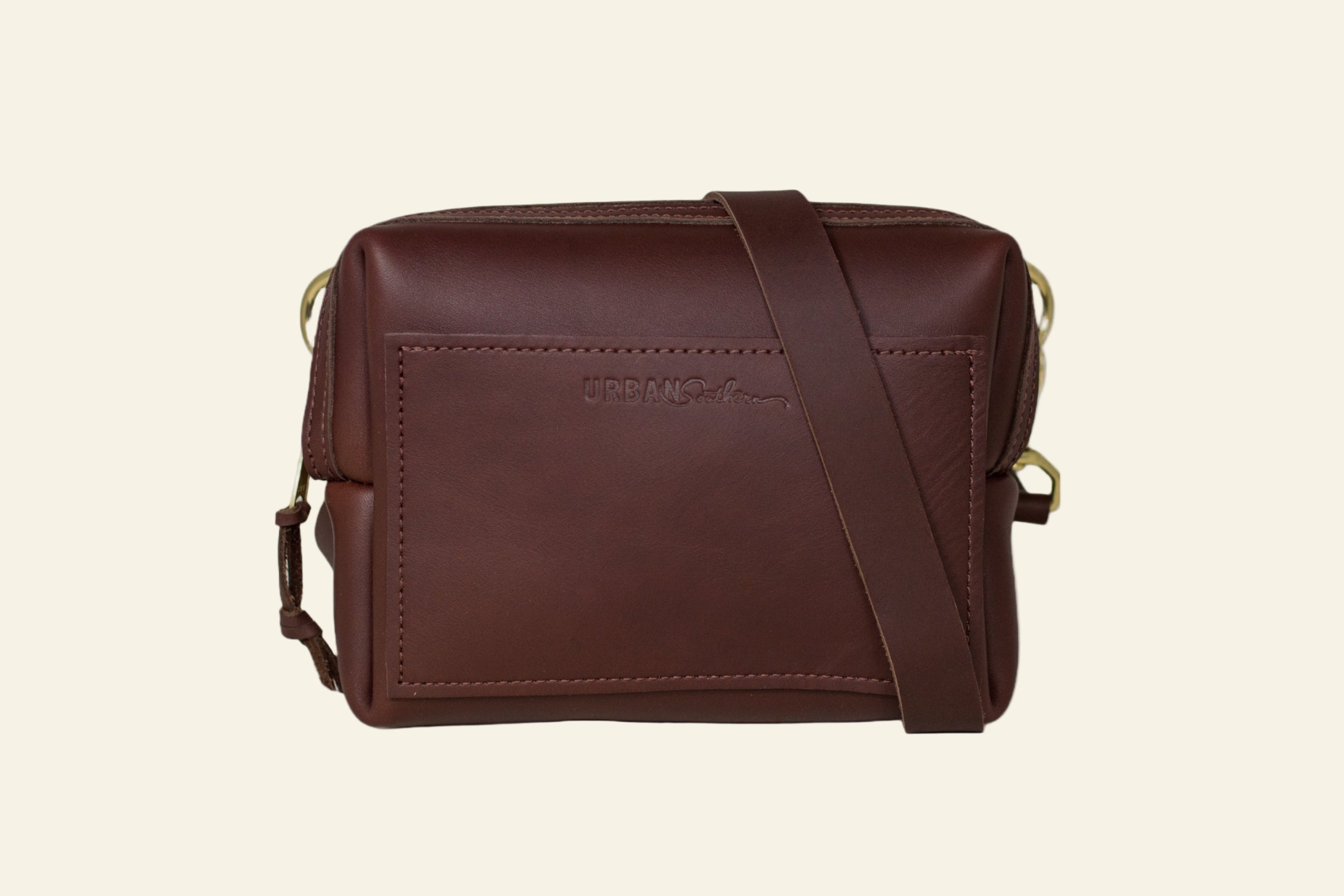 Brown leather crossbody bag on a white background