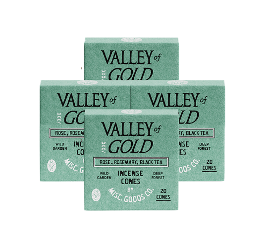 Multiple boxes of Valley of Gold incense cones on a white background