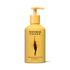 Wonder Valley Sandalwood Yuzu Shampoo in a yellow pump bottle with a black graphic of a woman holding a yuzu and the brand name &