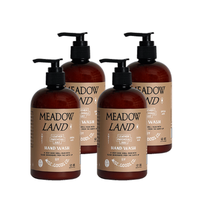 Four bottles of Meadow Land hand wash on a white background