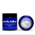 A dark blue jar of Purely Tallow Whipped Tallow Salt Scrub with a black lid, shown next to its open lid revealing white whipped cream inside, on a white background.