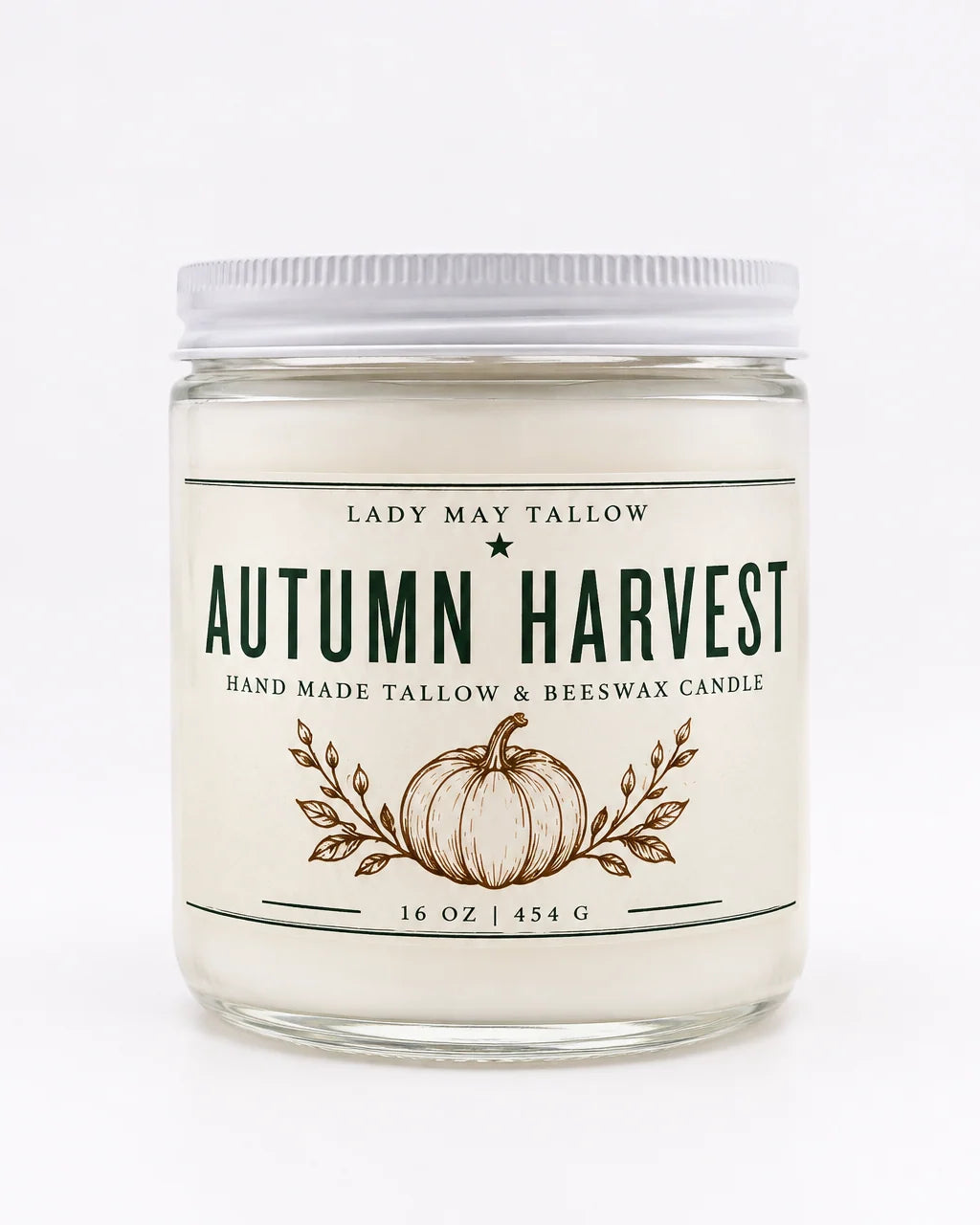 A 16 oz glass jar candle with a white lid and cream-colored label, featuring &
