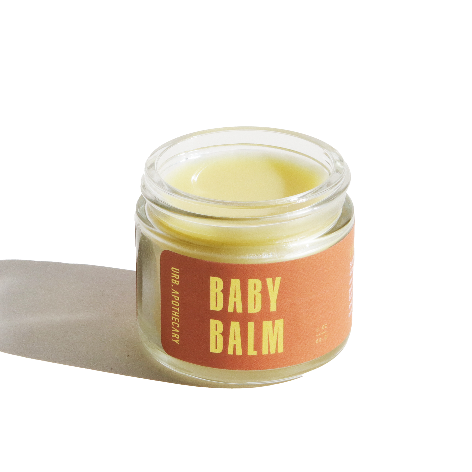 Jar of baby balm with a visible brand label on a white background