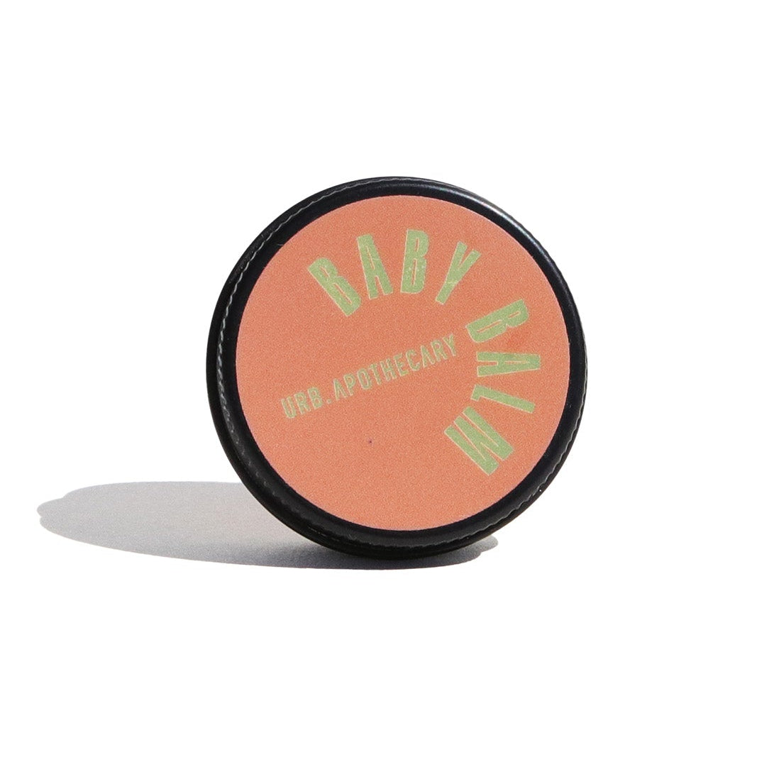 Cosmetic compact with brand logo on a white background