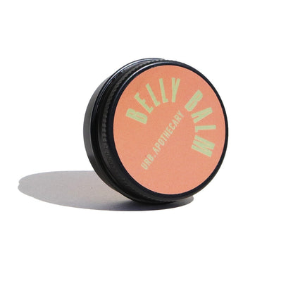Pink balm container with black lid on a white background