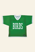 A green short-sleeve hockey-style jersey with white trim and the word &