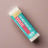 Lip balm with a colorful label on a white background