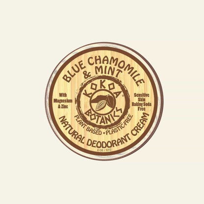 Koka Botanics natural deodorant cream container with wooden lid on a white background