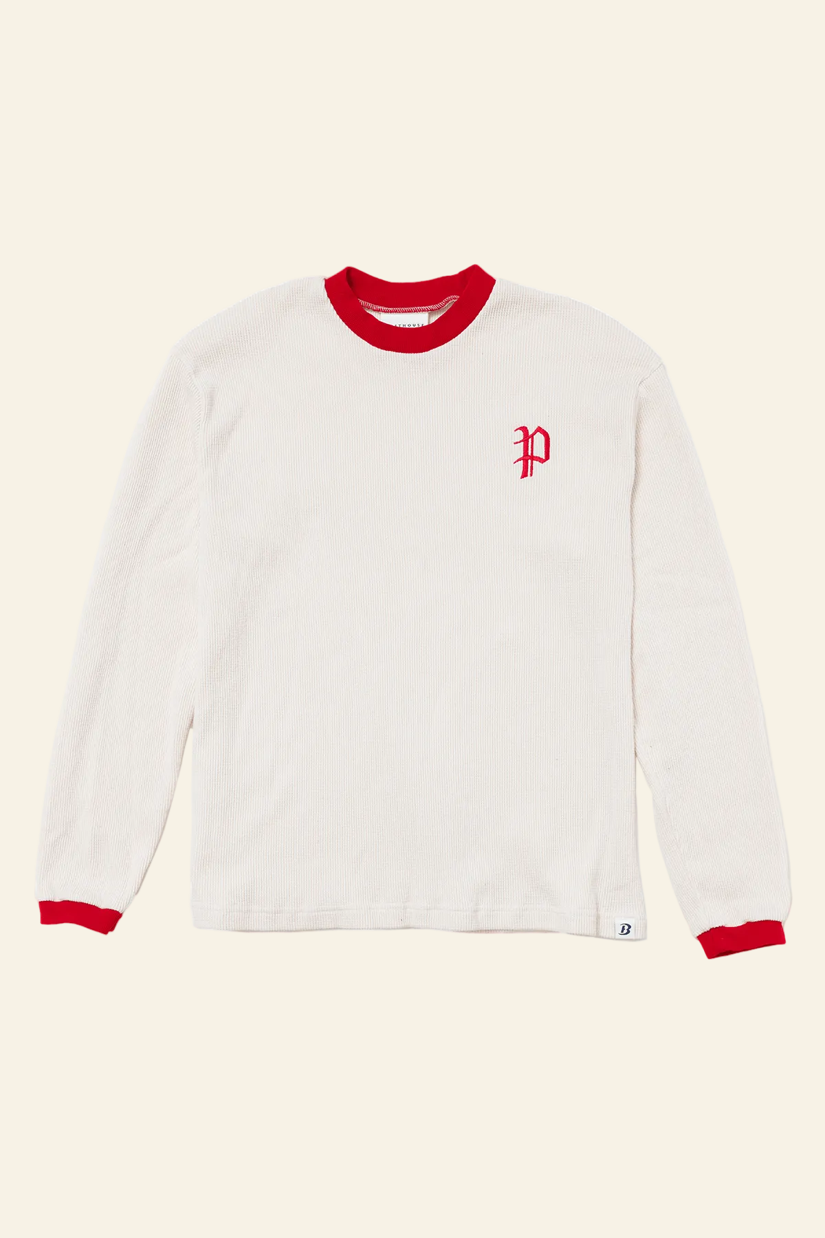 White long-sleeve shirt with red trim and logo on a white background