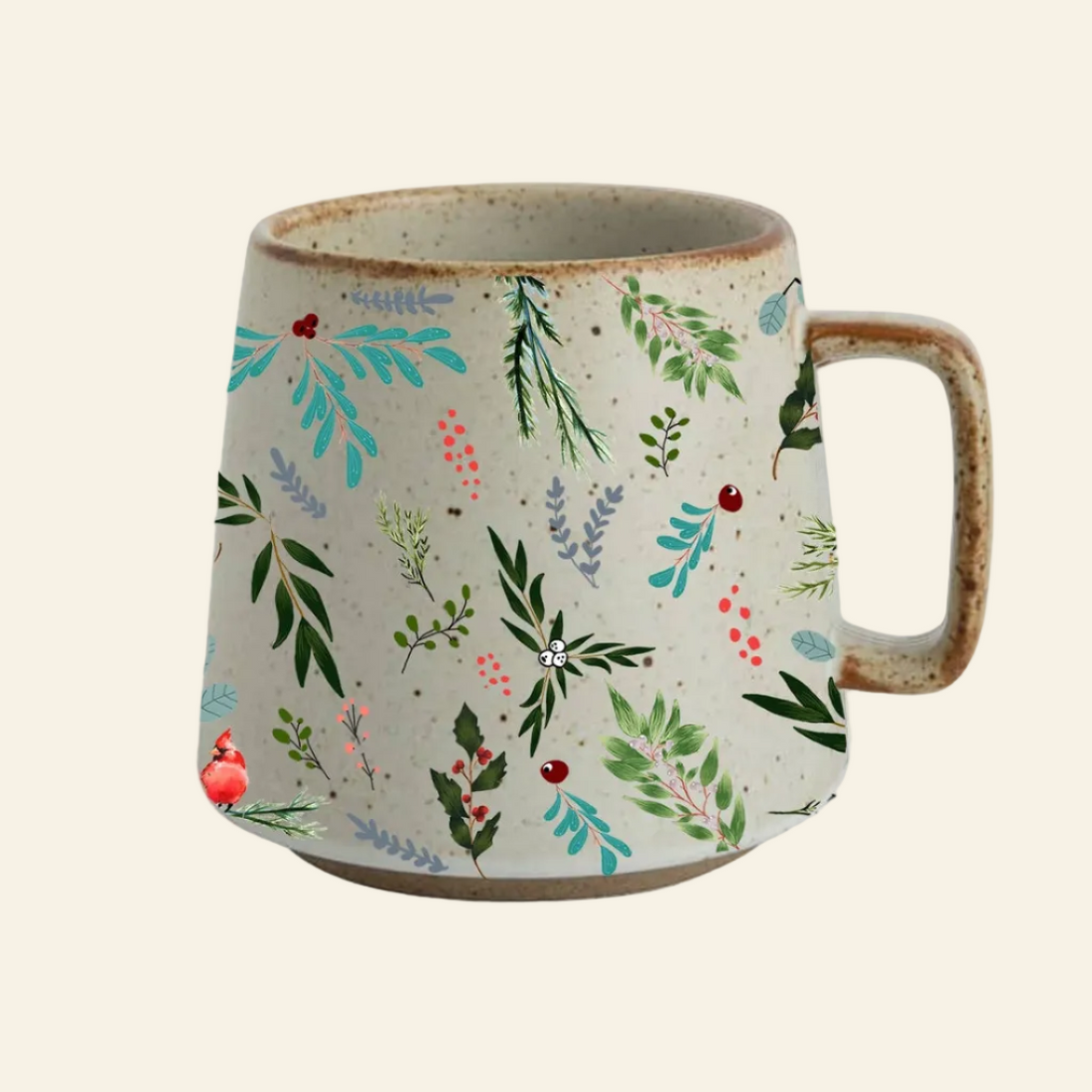 A handmade ceramic mug with a textured beige base, decorated with a colorful botanical pattern of green leaves, blue foliage, and small red berries, featuring a rustic brown handle and rim.