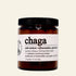Jar of chaga mushroom extract on a white background