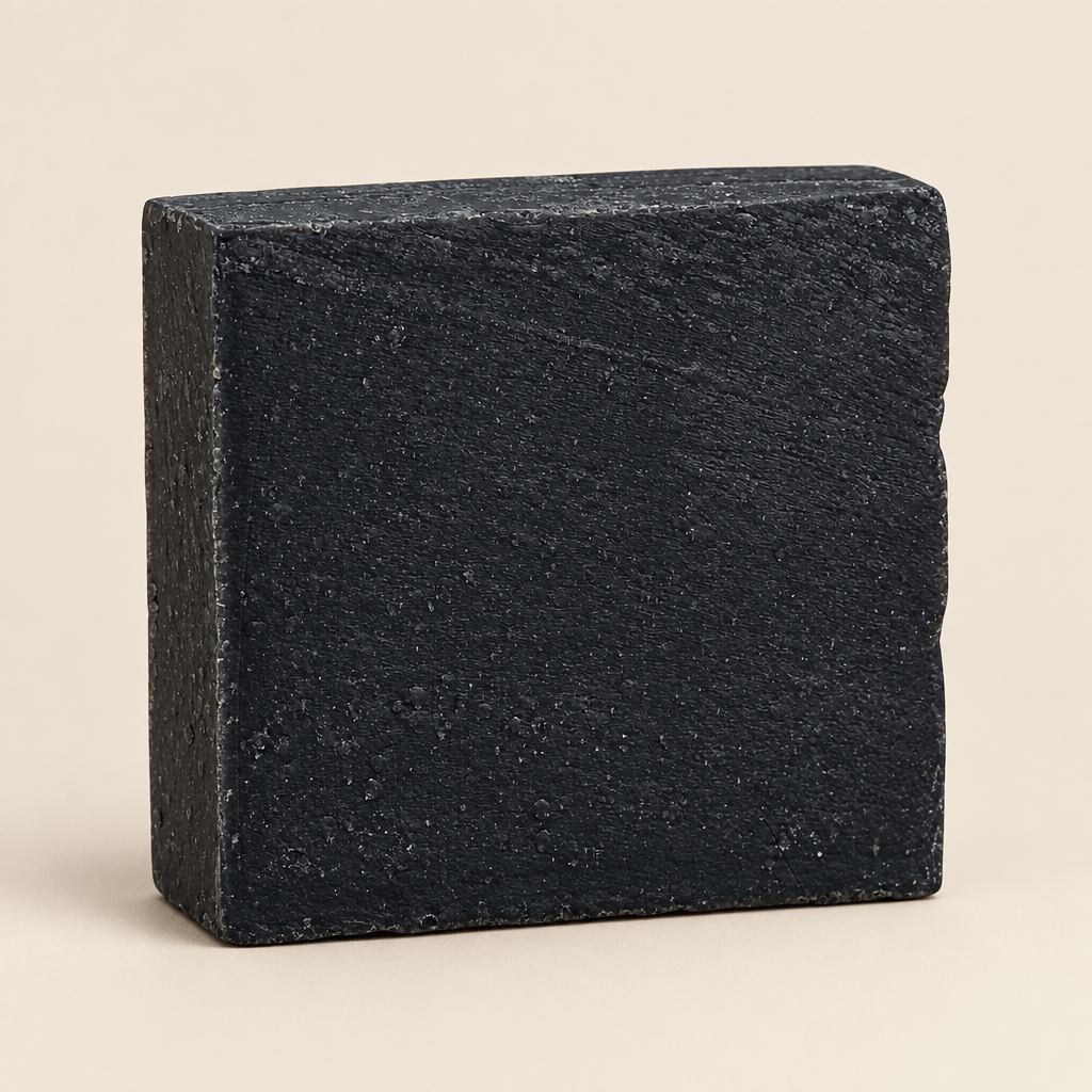 Black soap bar on a white background