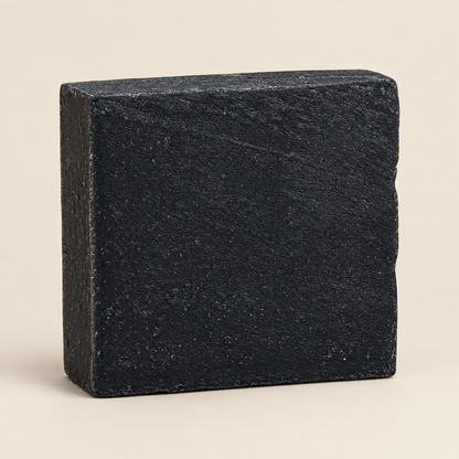 Black soap bar on a white background